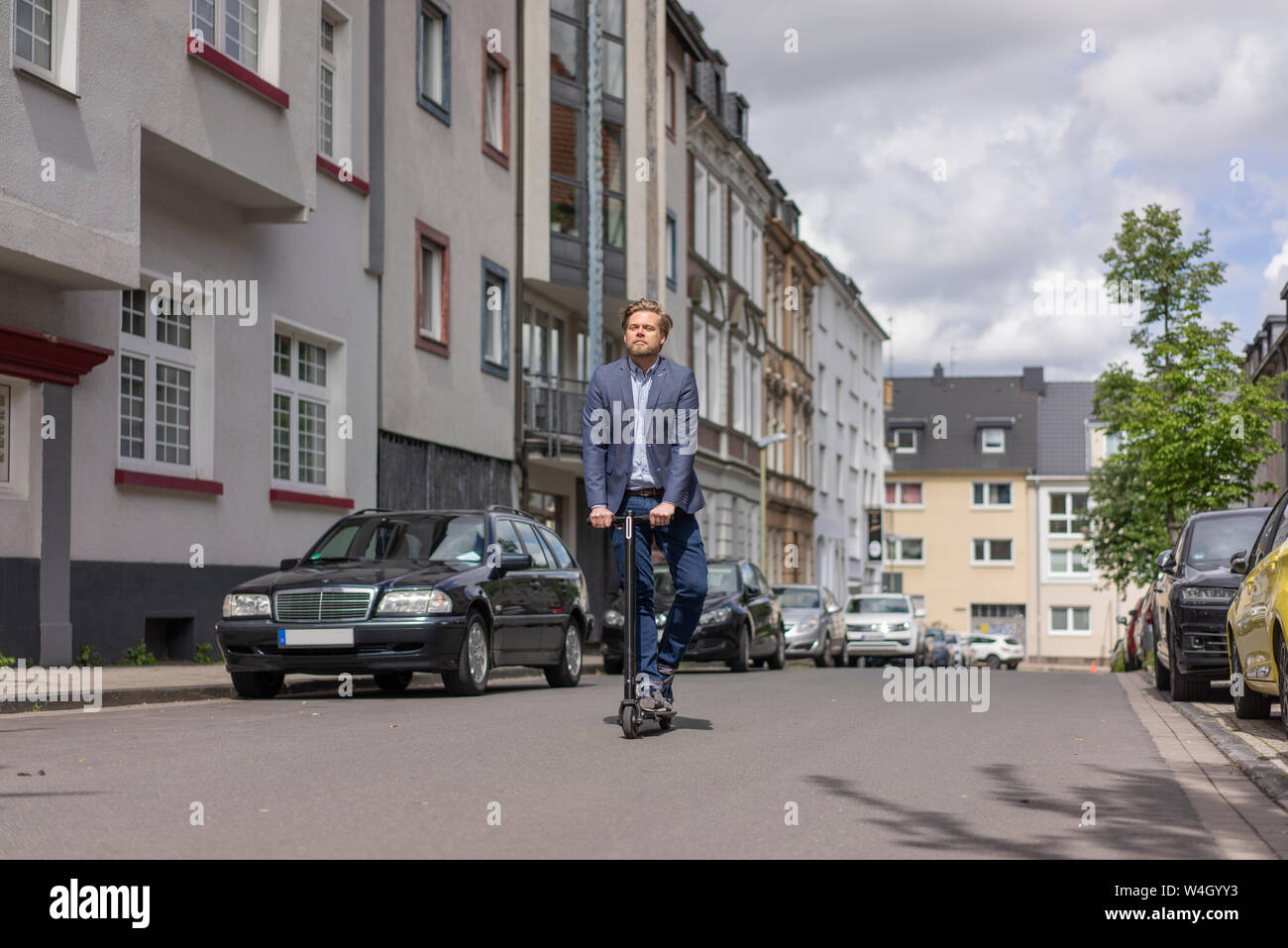 Man riding e scooter germany hi-res stock photography and images - Alamy