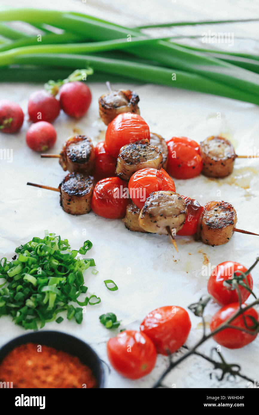 Cooking recipe. Delicious barbecue cooking method with tomatoes Stock Photo