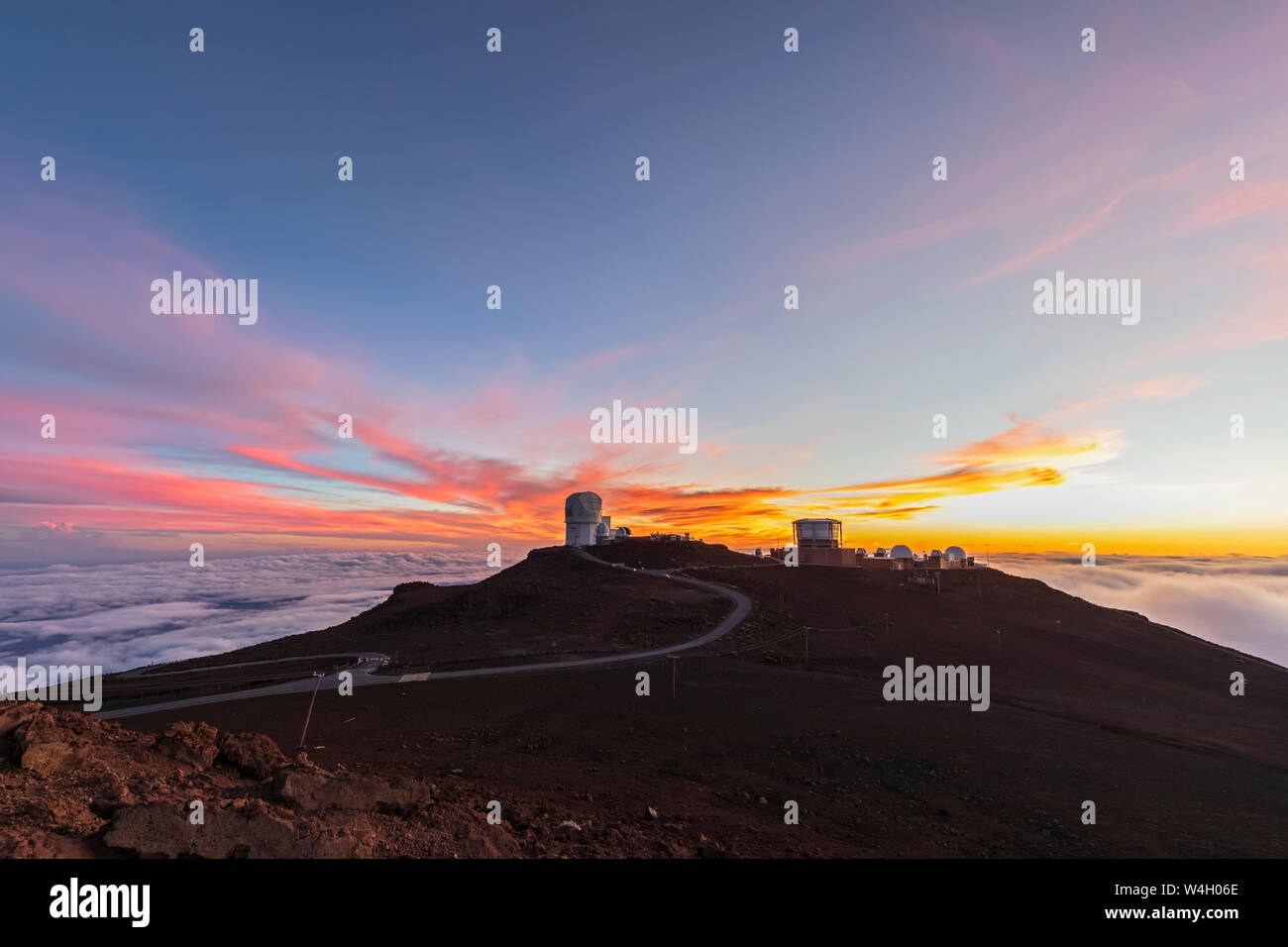 View from Red Hill summit to Haleakala Observatory at dusk, Maui, Hawaii, USA Stock Photo