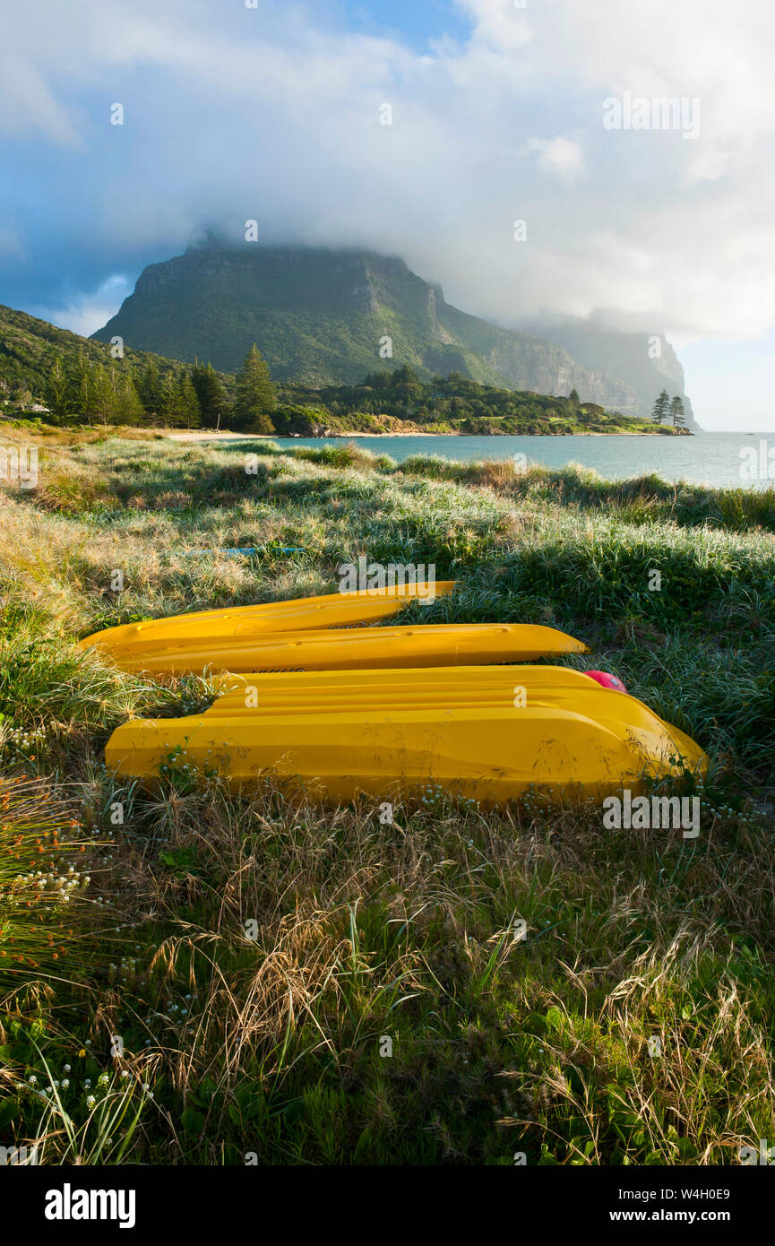 Canoes before Mount Lidgbird and Mount Gower on Lord Howe Island, New