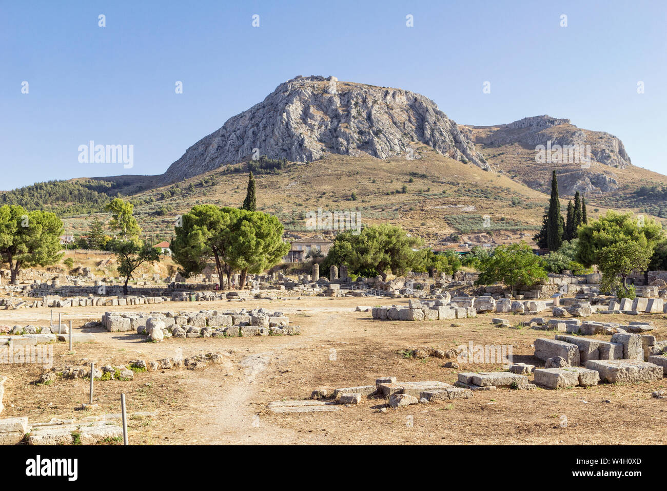 Archaeological site with view on Acrocorinth, Corinth, Greece Stock Photo