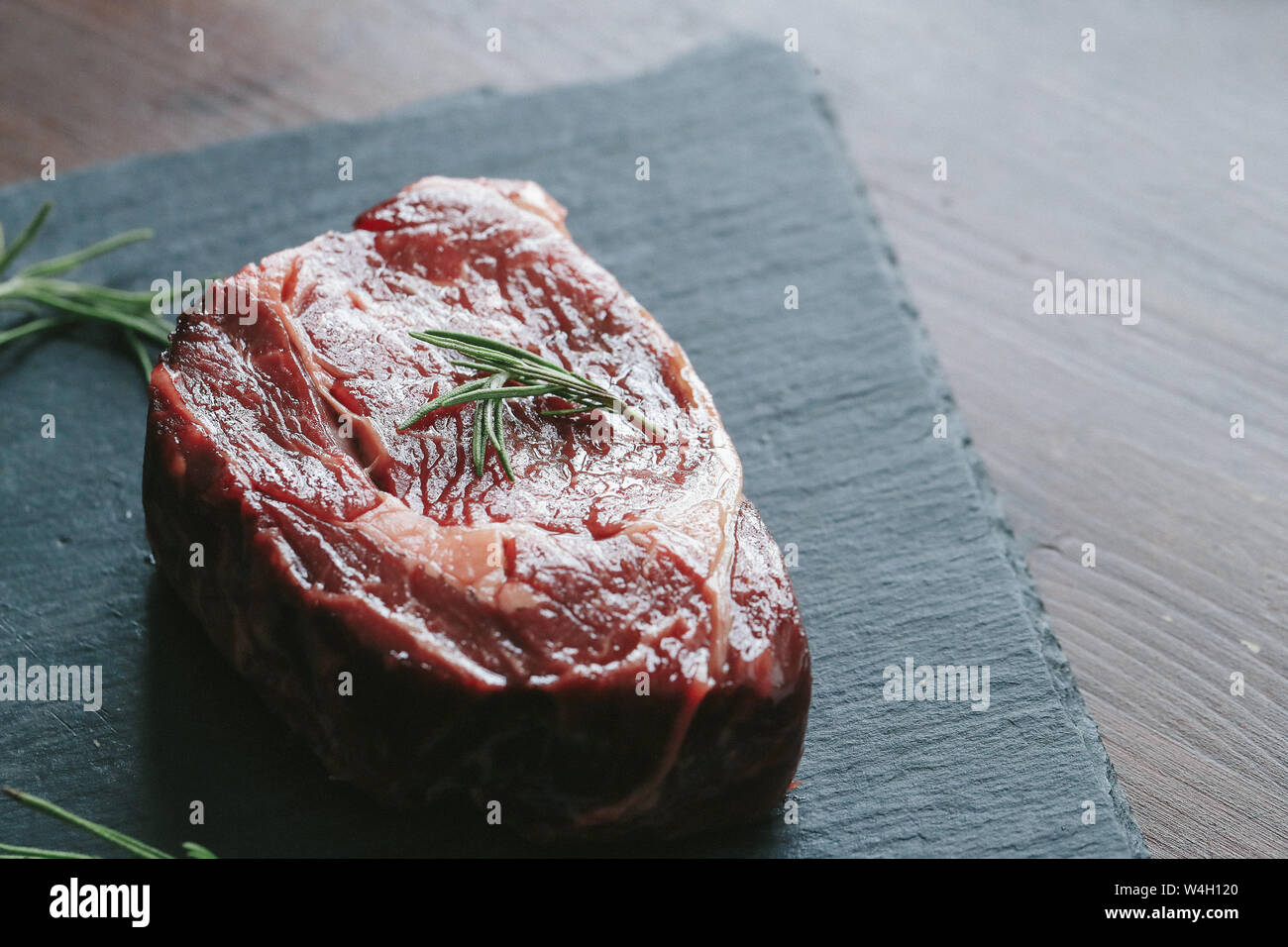 Cooking, meat preparation. Raw steak on the table Stock Photo