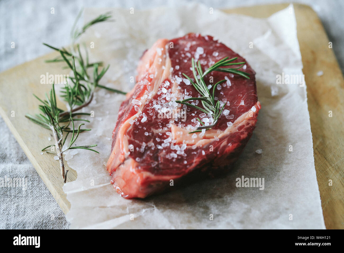 Cooking, meat preparation. Raw steak on the table Stock Photo