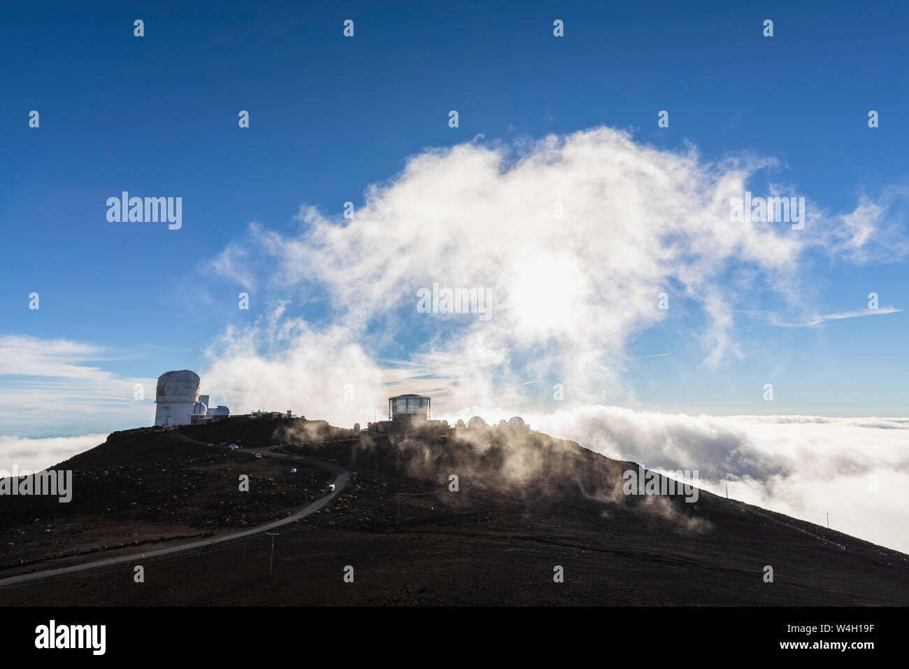 View from Red Hill summit to Haleakala Observatory at sunset, Maui, Hawaii, USA Stock Photo