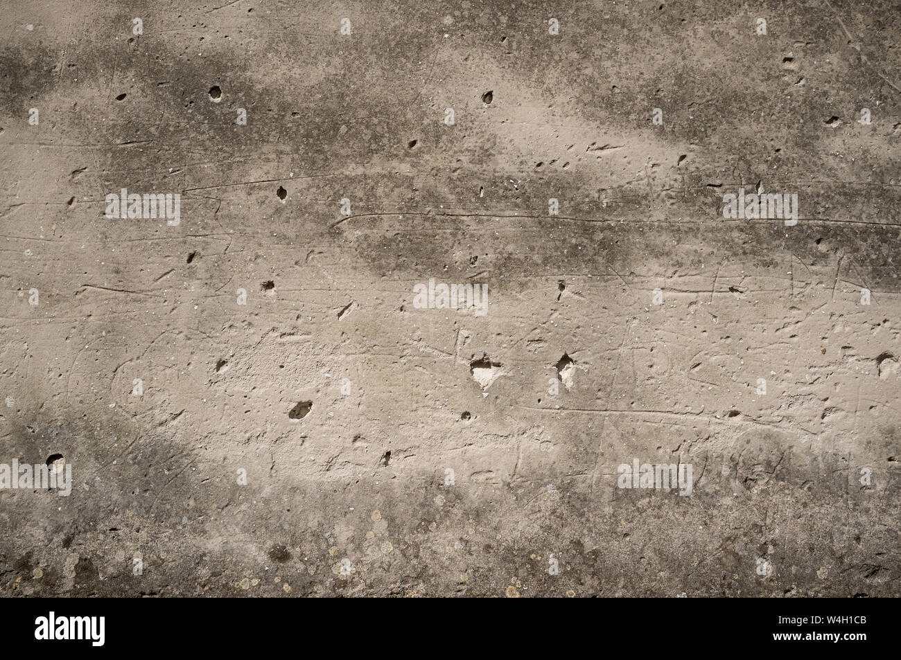 Detail of Old Weathered Wall Plaster With Holes and Scratches Stock Photo