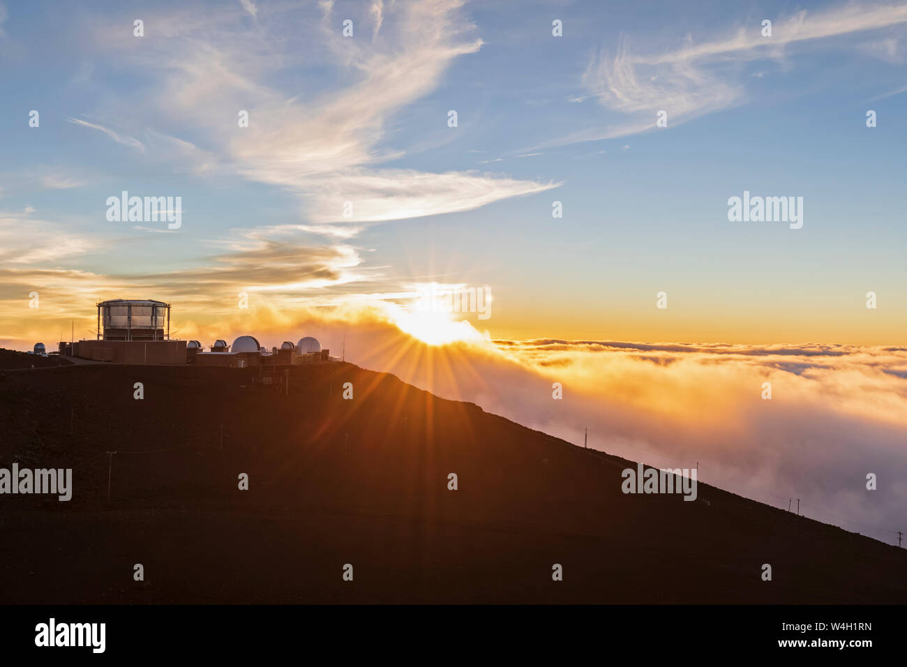 View from Red Hill summit to Haleakala Observatory at sunset, Maui, Hawaii, USA Stock Photo