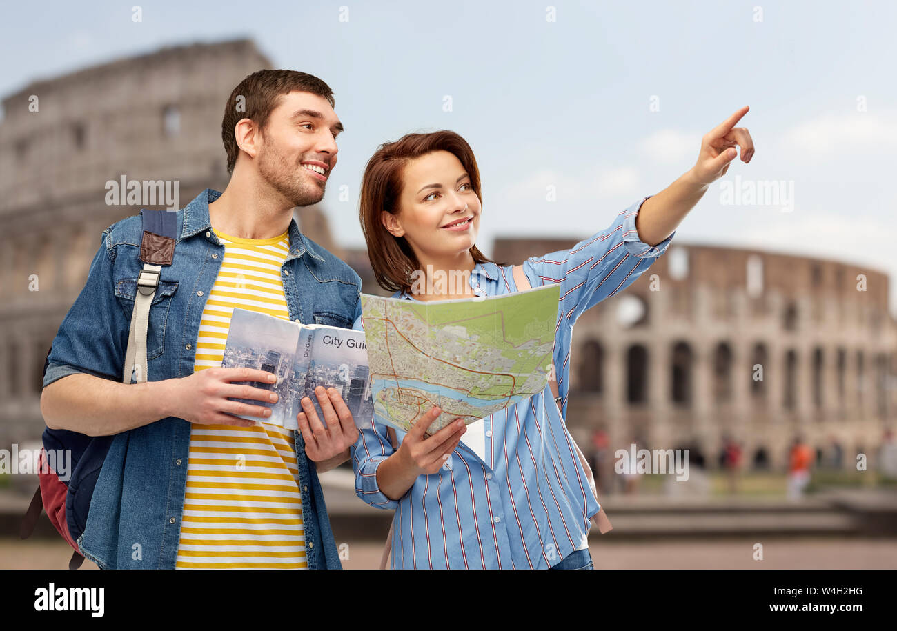 happy couple of tourists with city guide and map Stock Photo