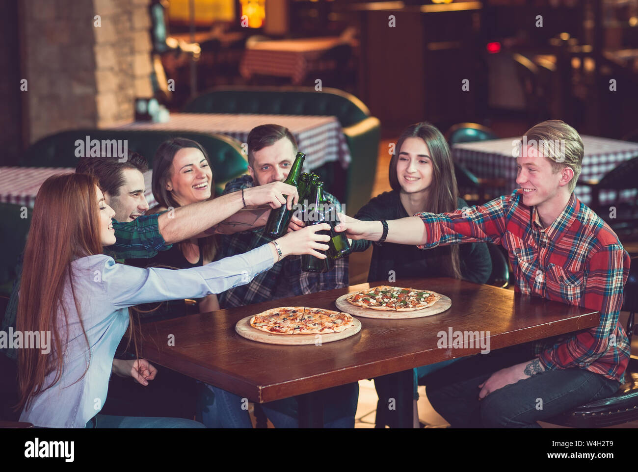 Group of friends sitting at bar hi-res stock photography and images - Alamy