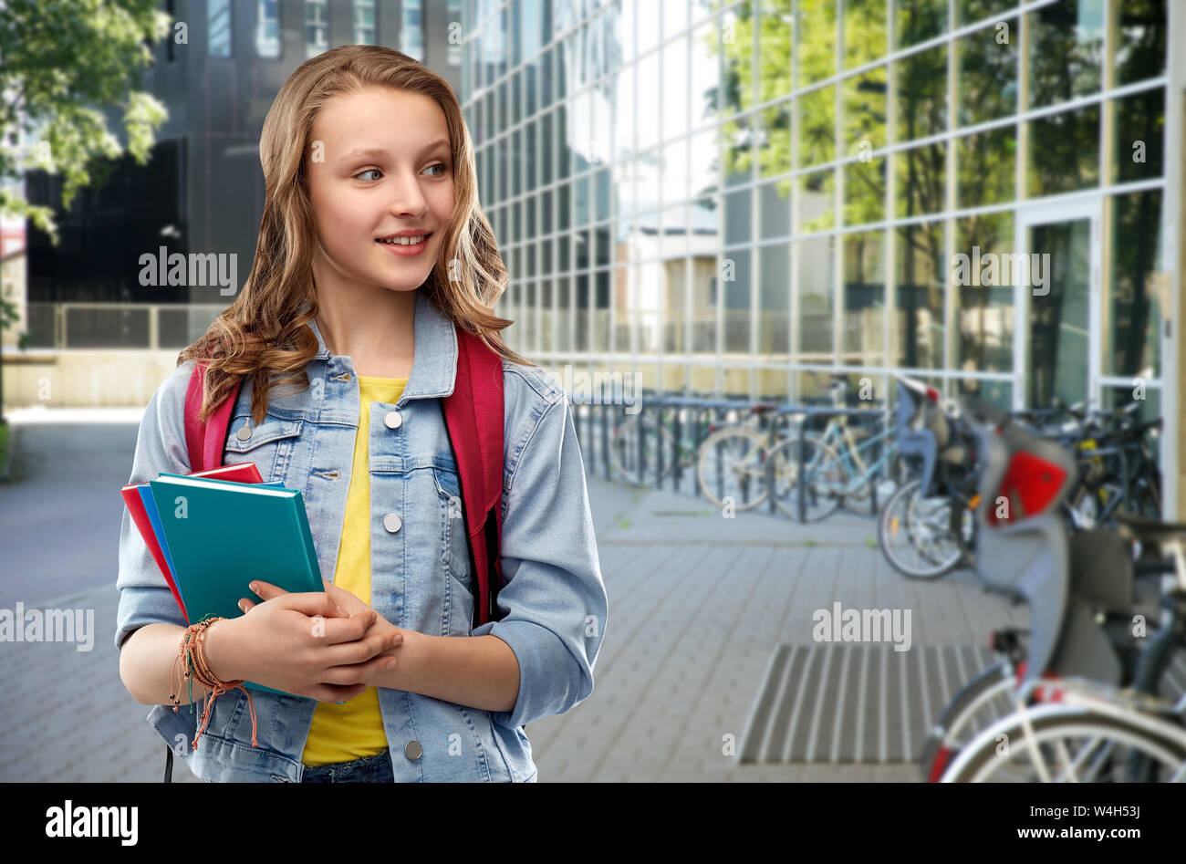 happy smiling teenage student girl with school bag Stock Photo - Alamy