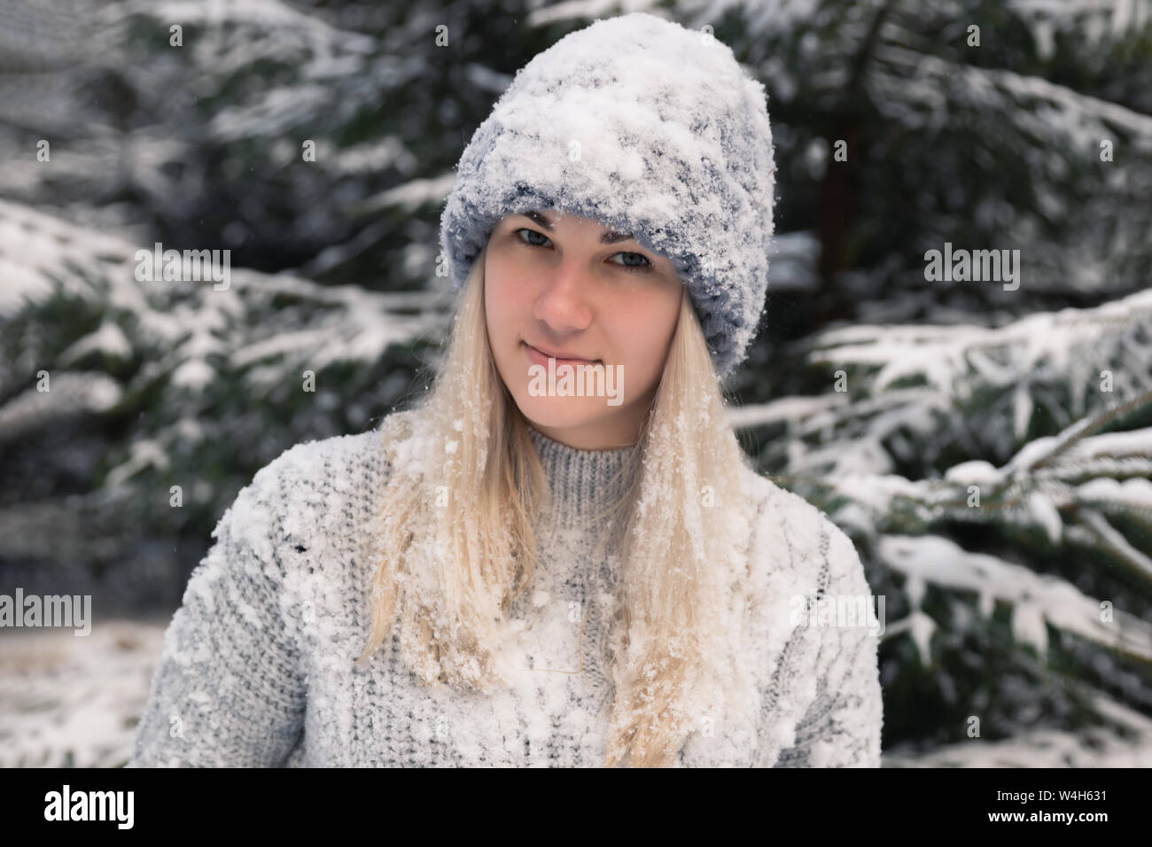 Young Beautiful Girl With Long White Hair Plays Snowballs She Has