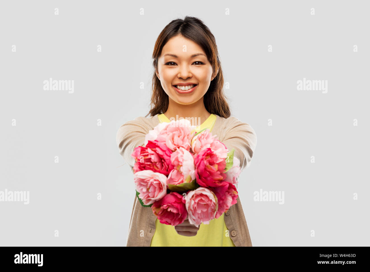 happy asian woman with bunch of flowers Stock Photo - Alamy