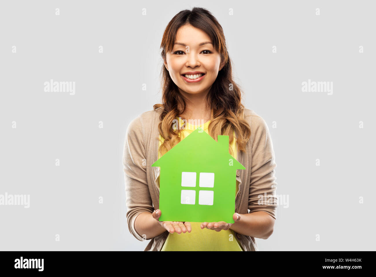 Young asian woman showing green hi-res stock photography and images - Alamy