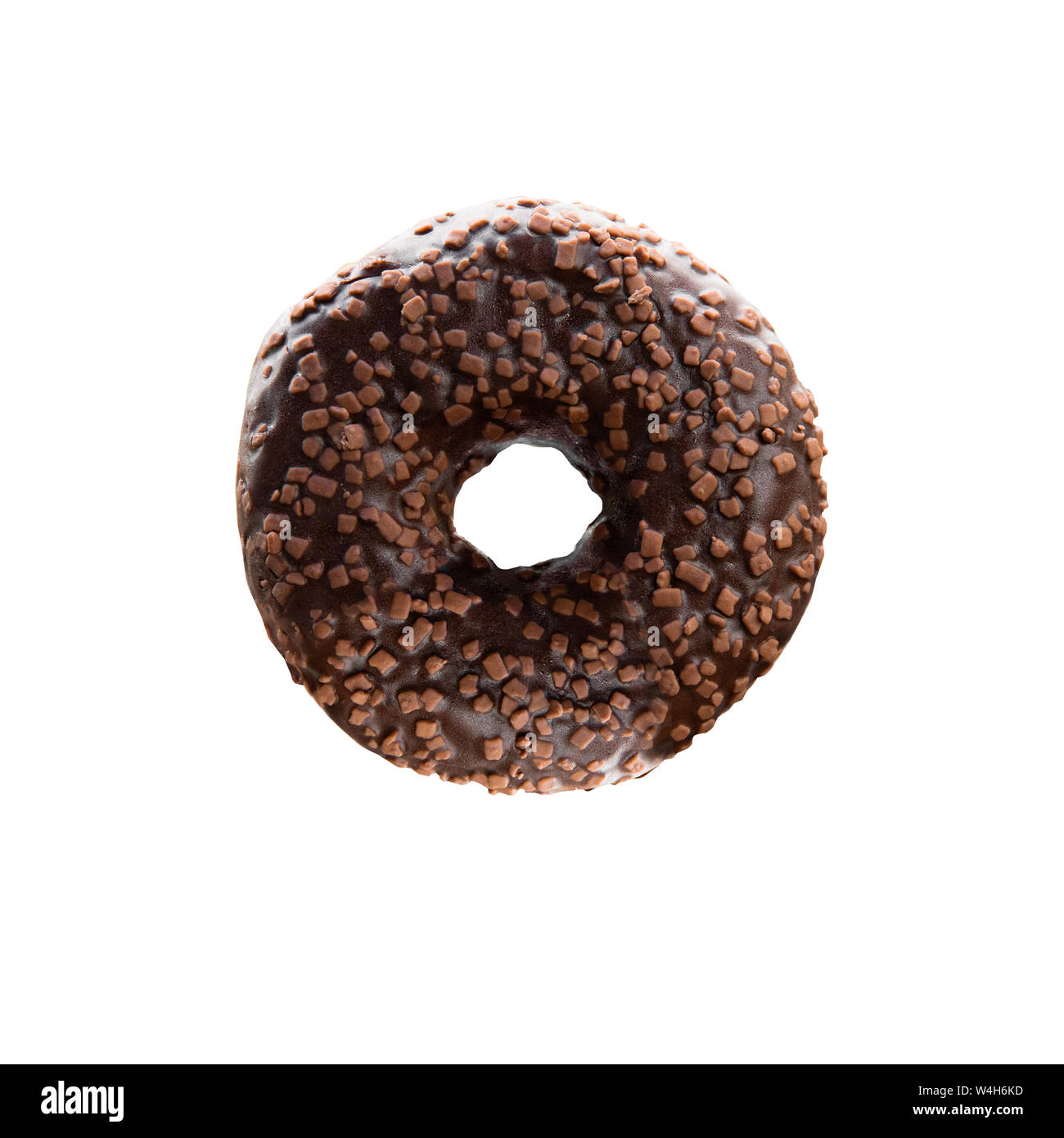 Chocolate donut with nut sprinkle. Isolated image on white background, close-up. Stock Photo
