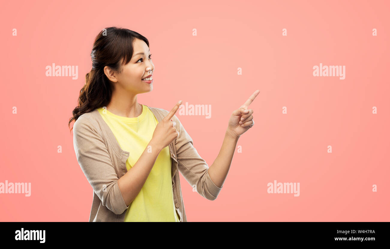 Pointing woman in coral hi-res stock photography and images - Alamy
