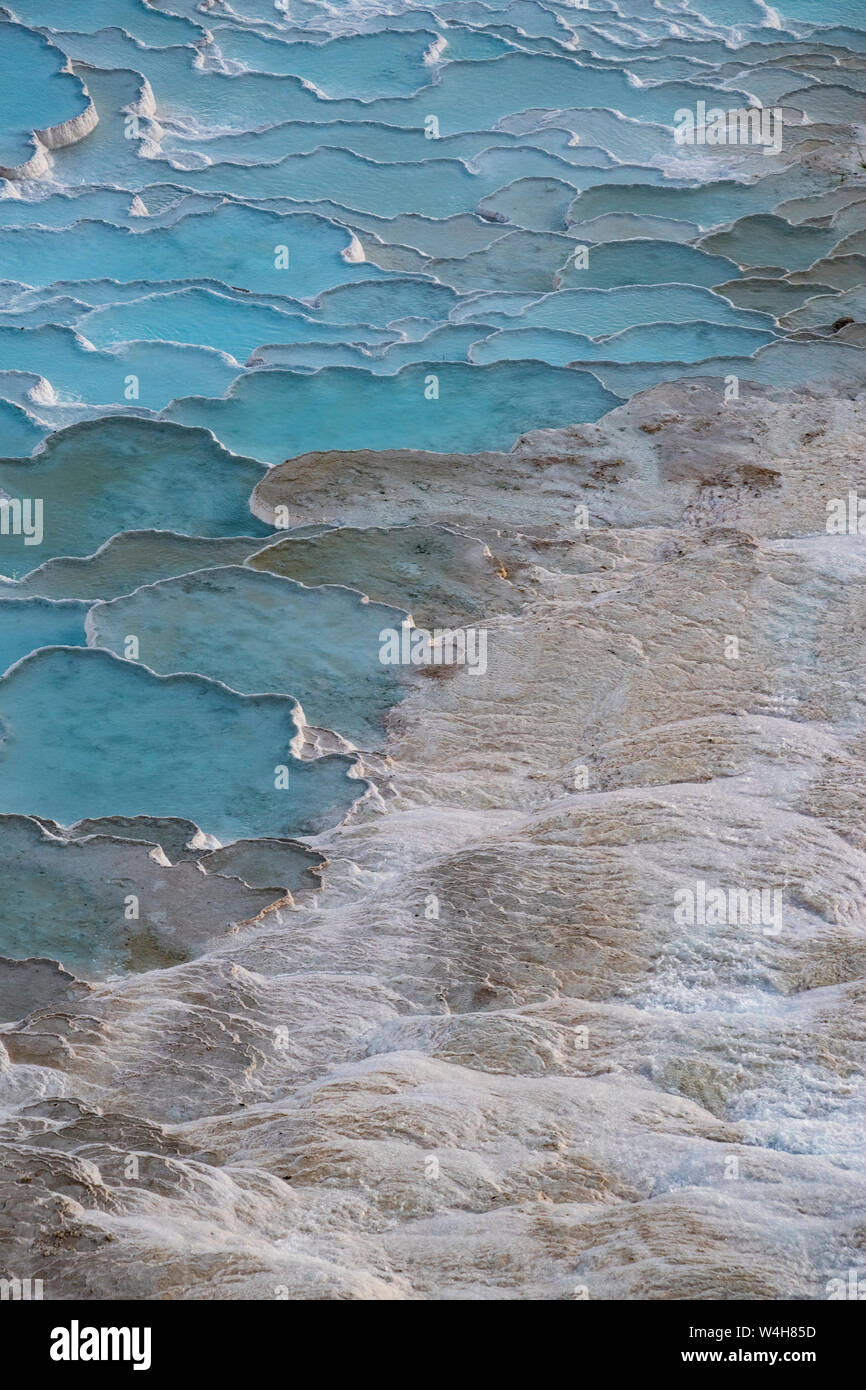 Turkey: details of the calcium pools on travertine terraces at Pamukkale (Cotton Castle), natural site of sedimentary rock deposited by hot springs Stock Photo