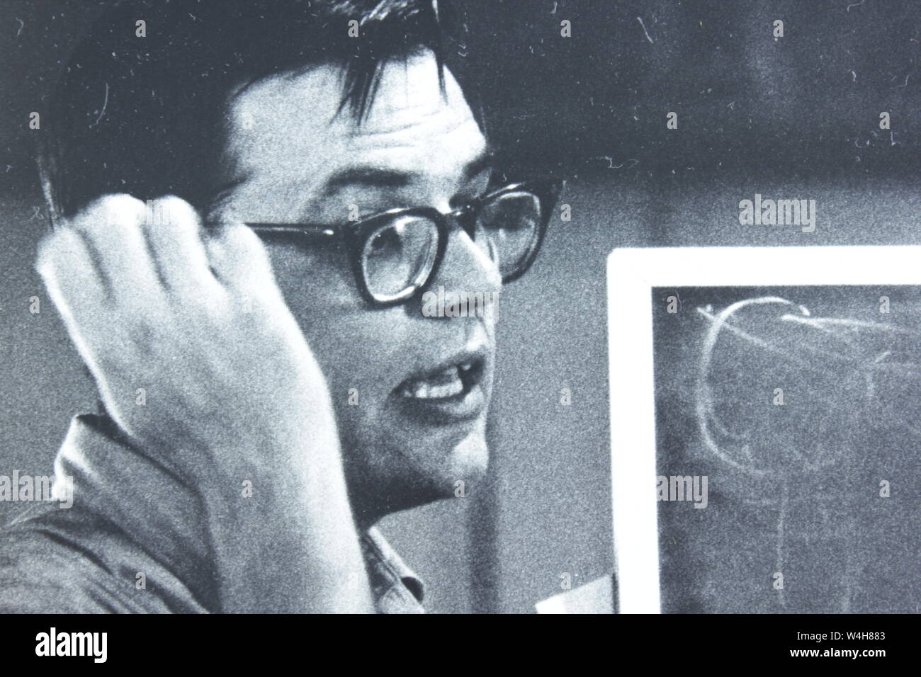 Fine black and white art photography of a bewildered scientist from the 1960s. Stock Photo