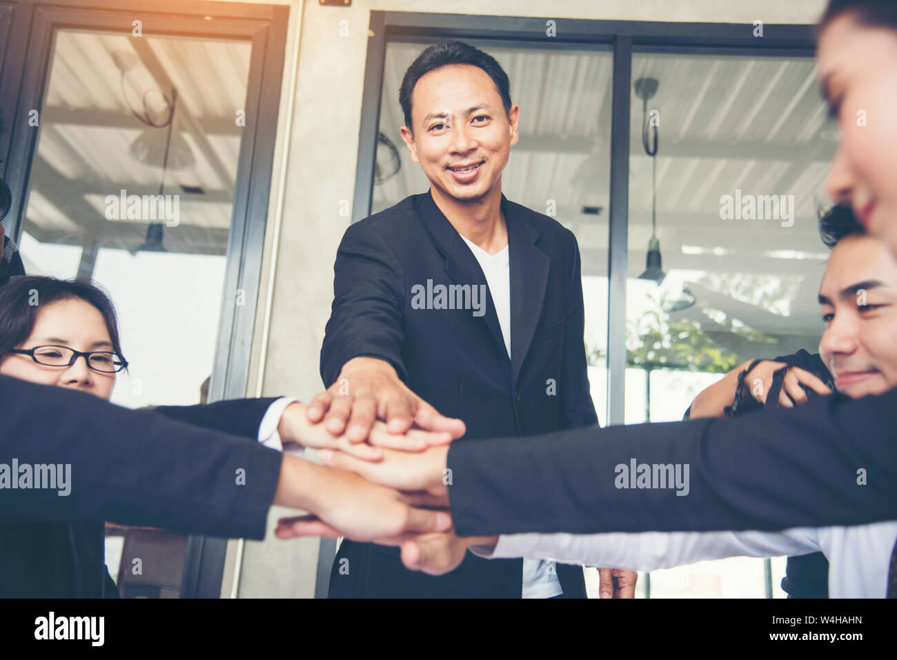 Close up of Stack hands of business people join hand together. Business People Teamwork Collaboration Relation Concept. Stock Photo