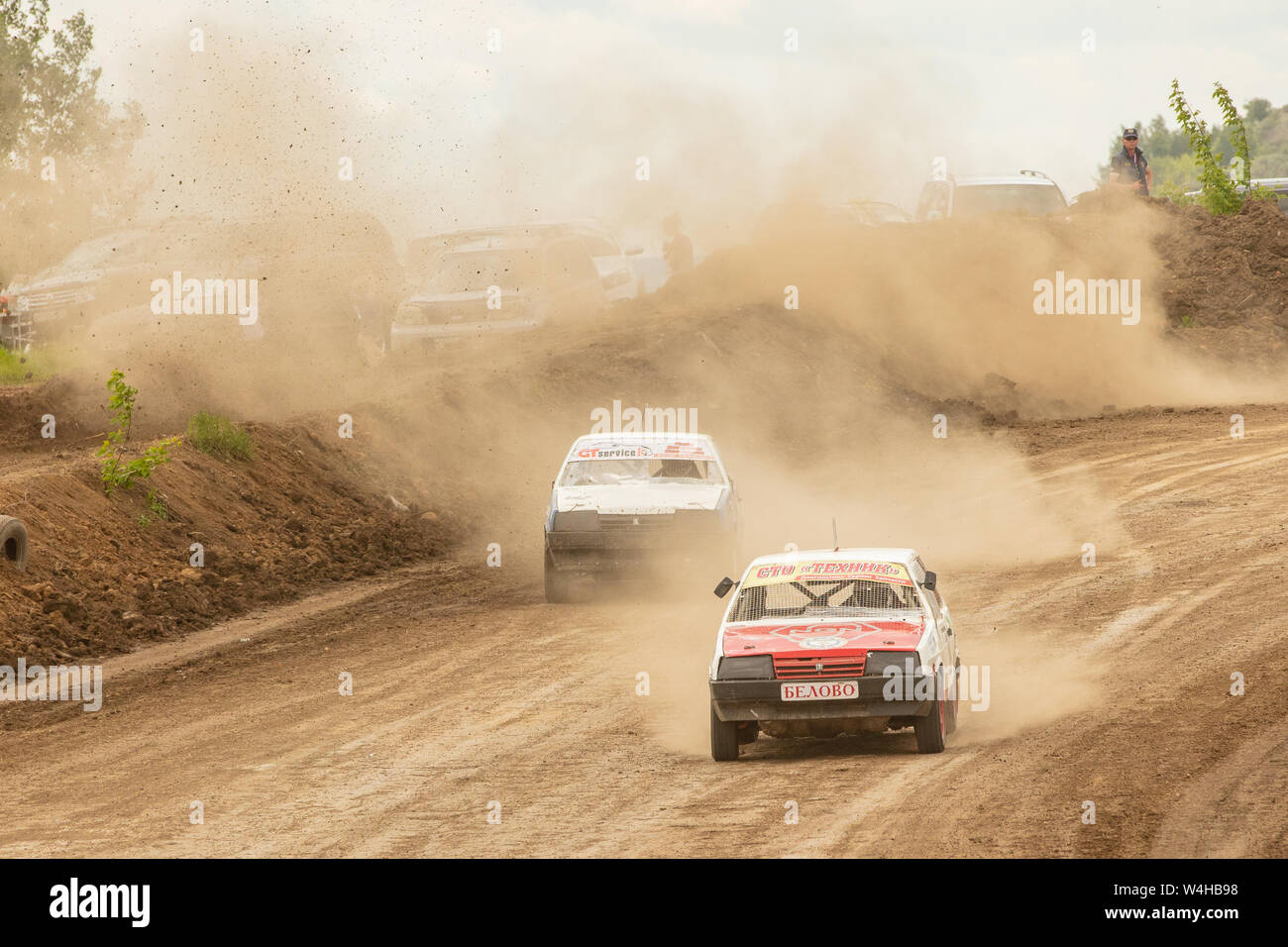 Traditional rally .The racing car drives into a steep turn, scattering ...