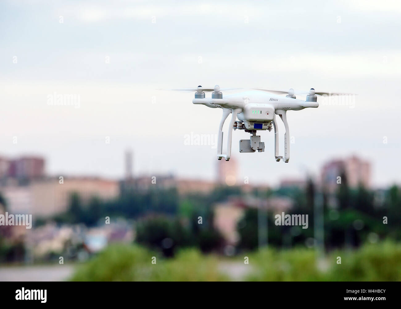drone quad copter with high resolution digital camera flying hovering ...