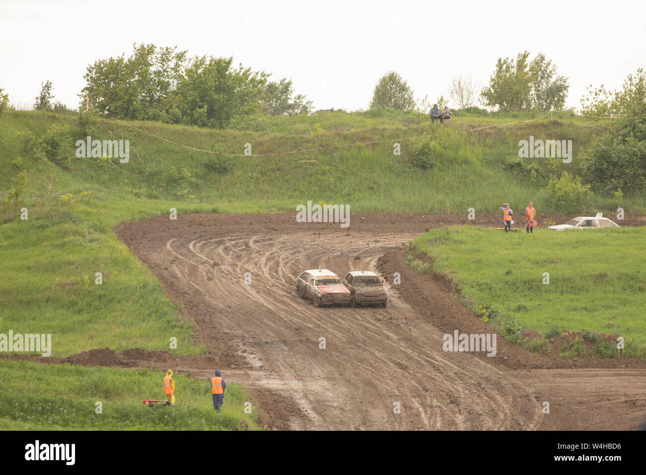 Traditional rally .The racing car drives into a steep turn, scattering ...