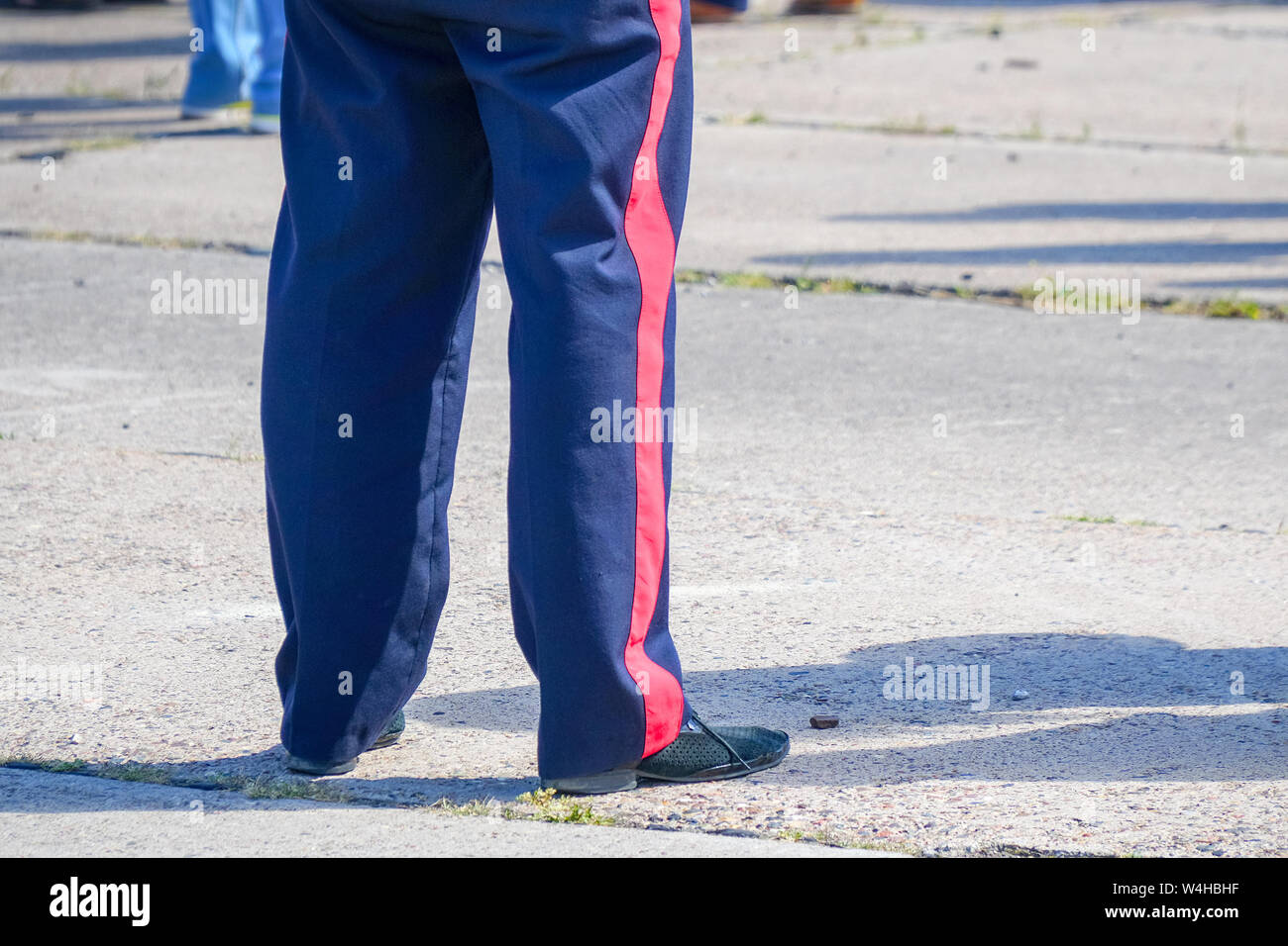 Blue trousers with a red stripe on the military man. Stock Photo