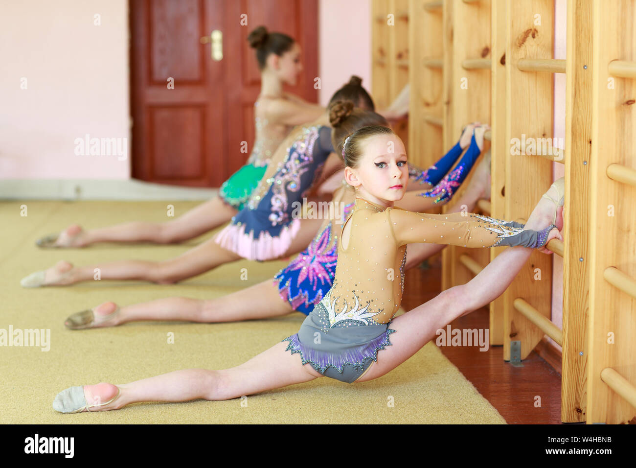 Young girls doing gymnastics in the gym. Stock Photo