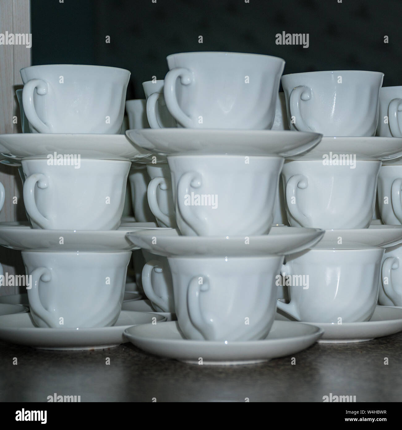 Coffee cups with saucers in stacks Stock Photo