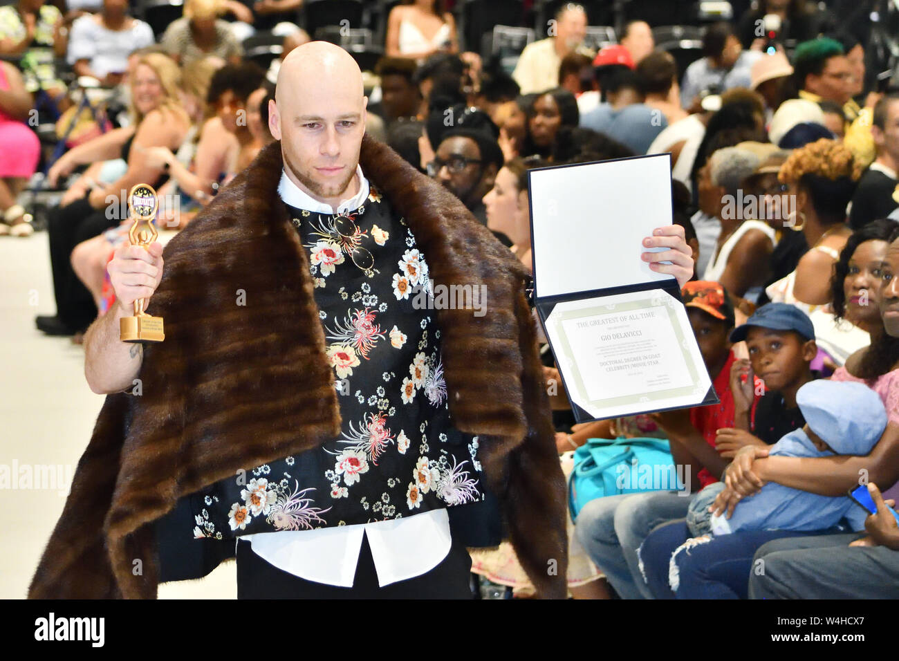 SuperModel Gio Delavicci shows off his GOAT (Greatest of All Time Award) at the Fashion on the Hudson show (2583) Stock Photo