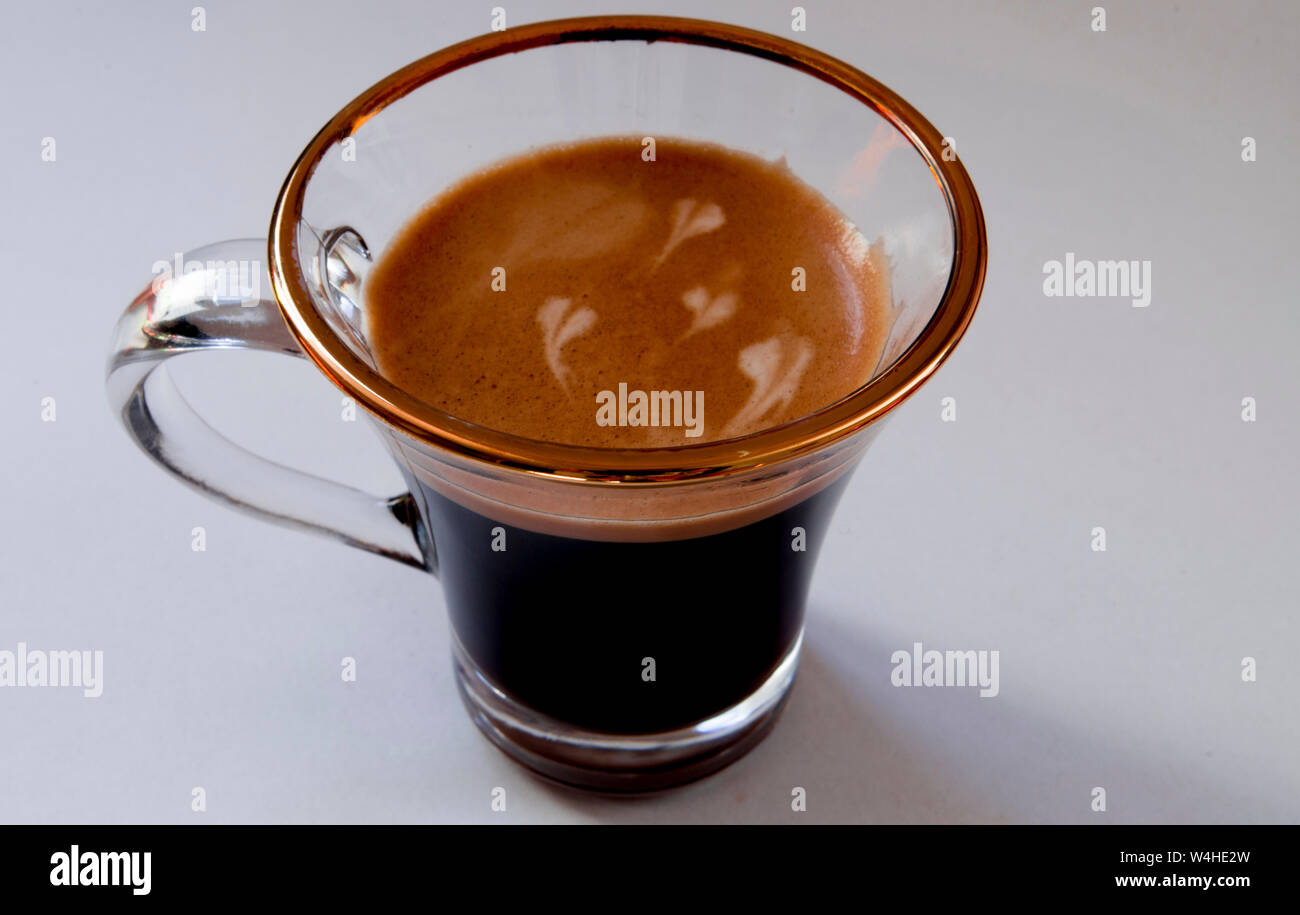 Espresso coffee with thick foam and milk hearts Stock Photo Alamy