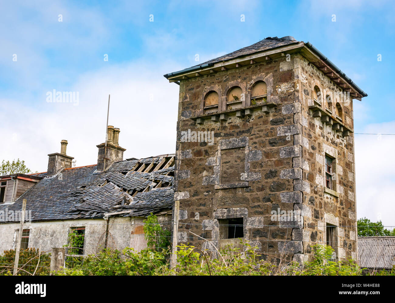 Dilapidated ruined old farmhouse and tower dovecote, Isle of Skye, Inner Hebrides, Scotland, Uk Stock Photo