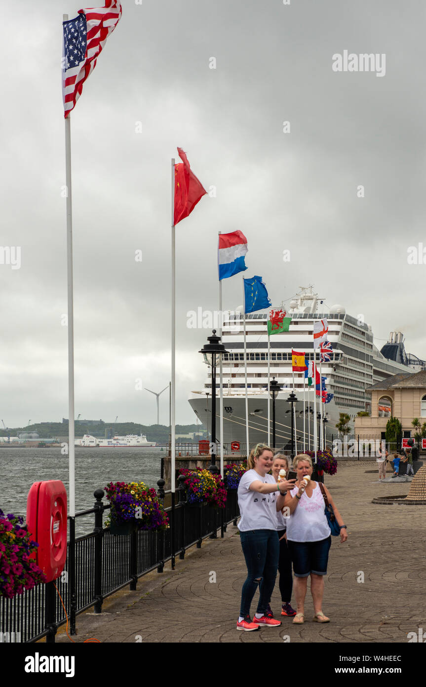 Female tourists taking a selfie at the Cobh cruise terminal as the MSC ...