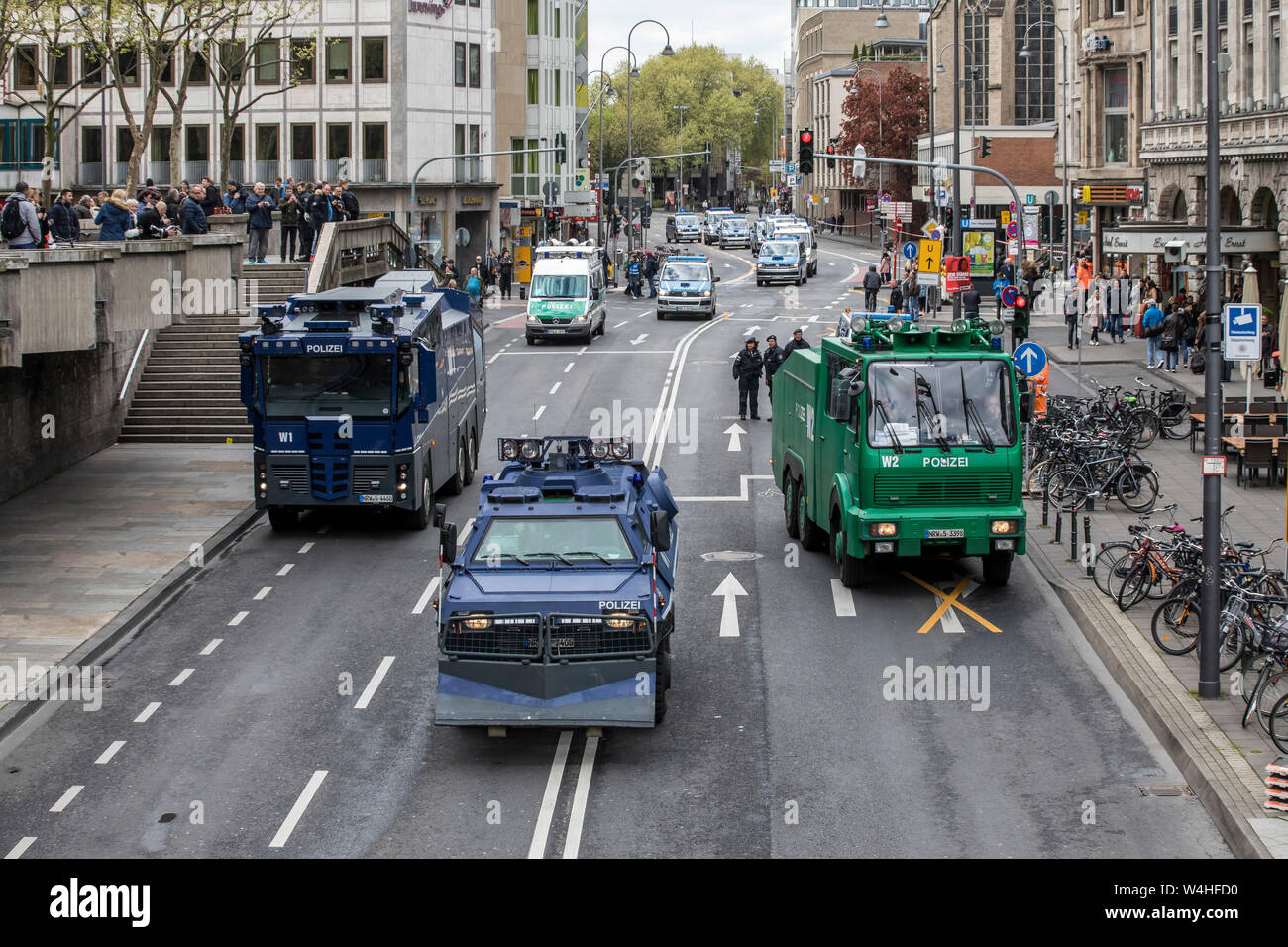 Police special vehicles, water cannons, snowploughs, armored, during protests against the AFD party conference in Cologne, at the station forecourt, Stock Photo