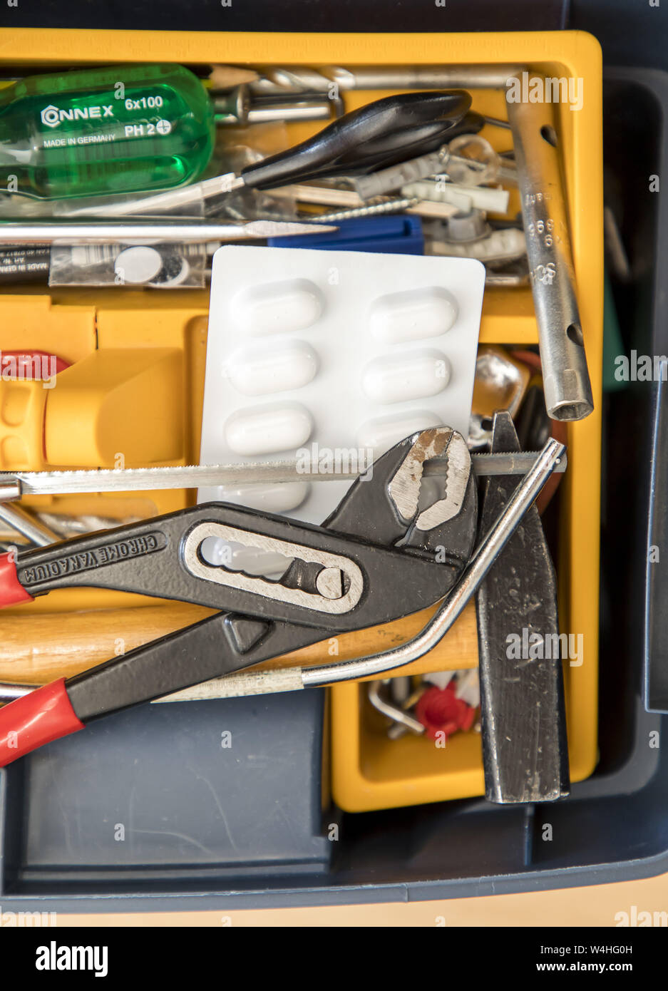 Symbol picture drug addiction, tablets, at work, craftsman, tool box, Stock Photo