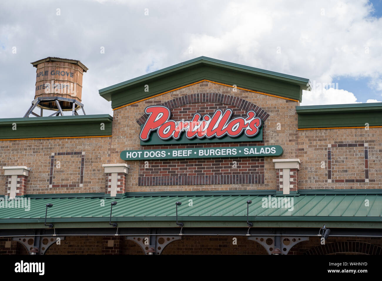 Maple Grove, Minnesota - July 21, 2019: Exterior of a Portillos Hot Dog restaurant, known for their famous Chicago dogs. Close up of the logo Stock Photo