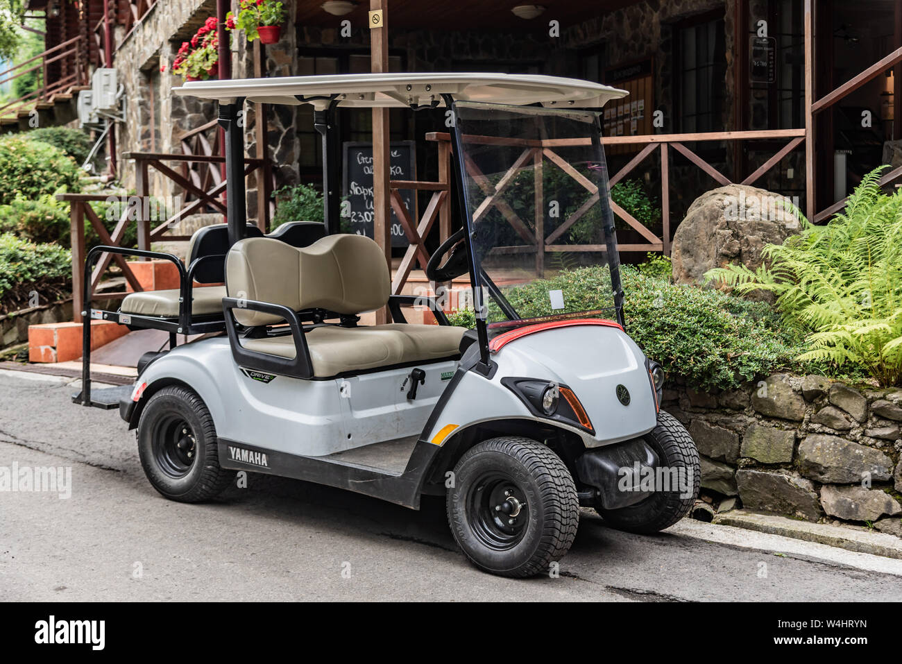Golfmobile for transportation of tourists and athletes in the parking lot. Stock Photo