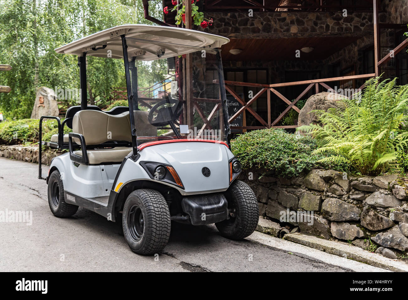 Golfmobile for transportation of tourists and athletes in the parking lot. Stock Photo