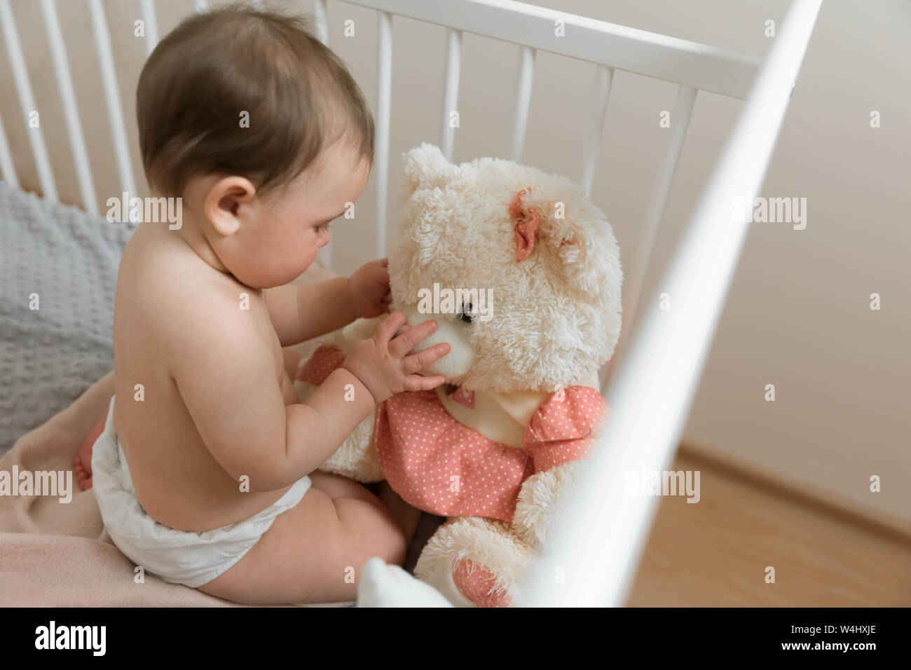 stuffed animals in crib