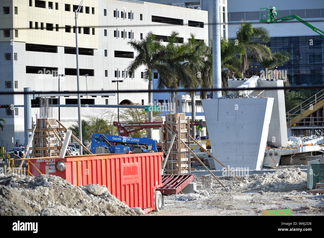 MIAMI, FL - MARCH 17: Crack on Florida Bridge Was Discussed in Meeting Hours Before Collapse - Scene where a pedestrian bridge collapsed a few days after it was built over southwest 8th street allowing people to bypass the busy street to reach Florida International University on March 17, 2018 in Miami, Florida. Reports indicate that there are at least 6 fatalities as a result of the collapse, which crushed at least five cars. Fireman remove rubble delicately by hand in respect for the deceased and their families  People:  Atmosphere Stock Photo
