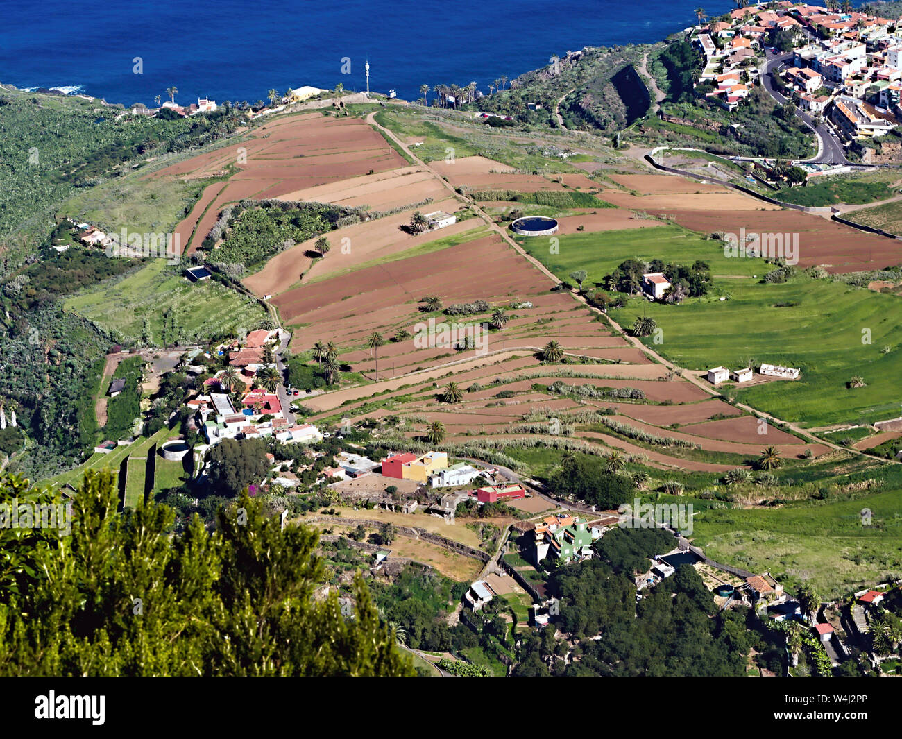 View from the Mirador de El Lance down to Los Realejos and the brown cultivated terrace fields to the coast and the Playa del castro on Tenerife on th Stock Photo