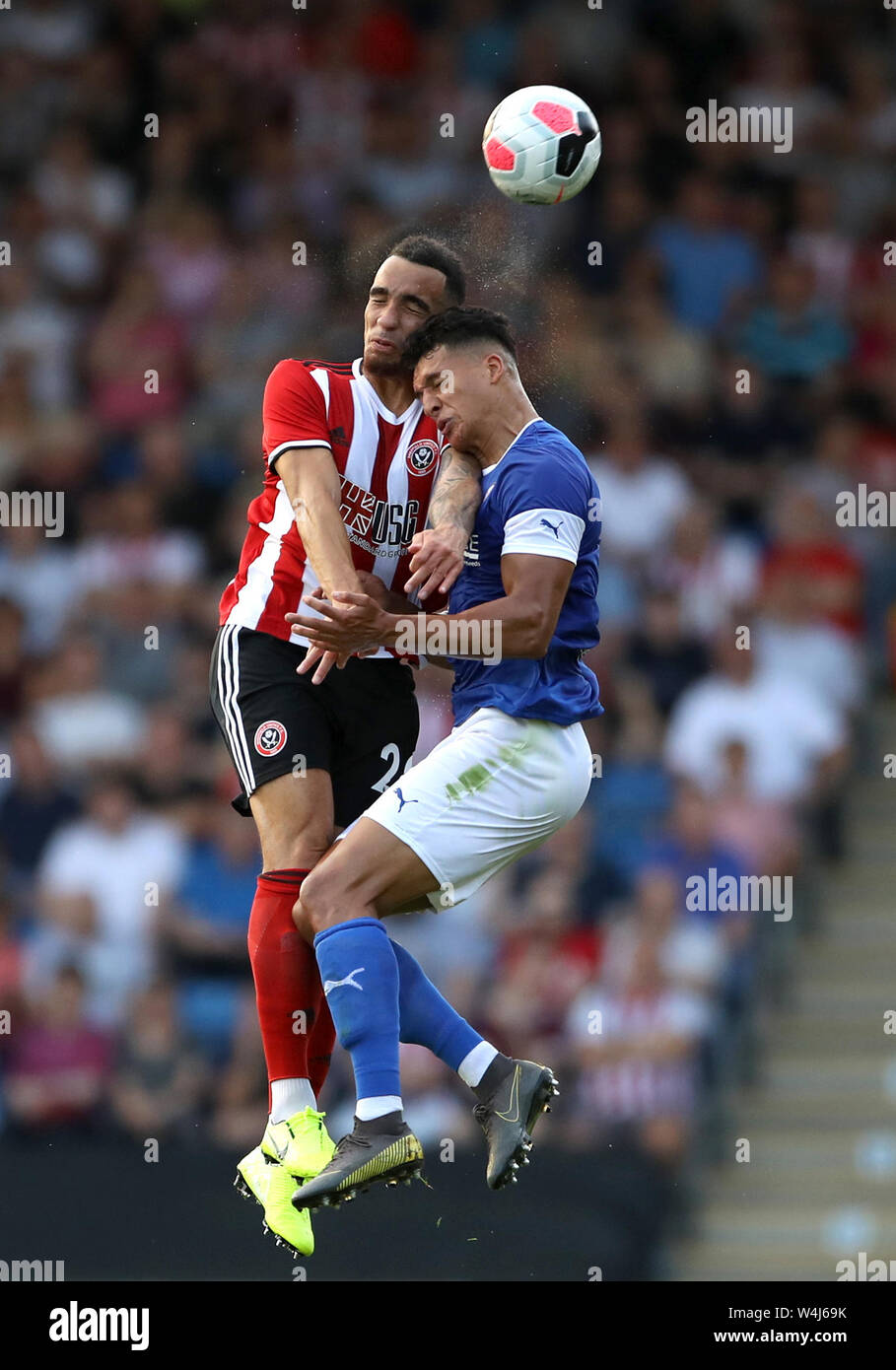 Sheffield United's Kean Bryan (left) and Chesterfield's Josef Yarney battle for the ball during the pre-season friendly match at the Proact Stadium, Chesterfield. Stock Photo