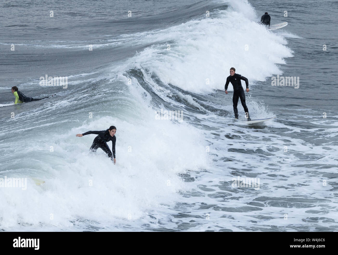 Surfers surfing at Saltburn by the sea, North Yorkshire, England. UK Stock Photo