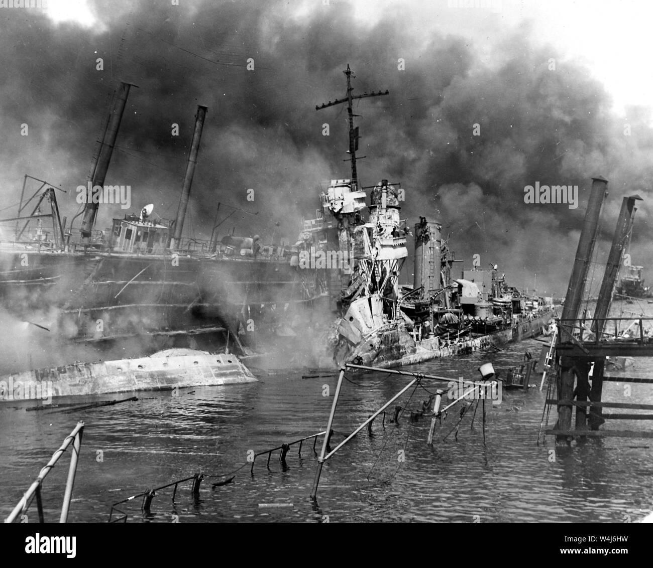 Destroyer USS Shaw, burning in floating drydock at Pearl Harbor after the Japanese attack on Pearl Harbor, Hawaii on December 7th, 1941 Stock Photo