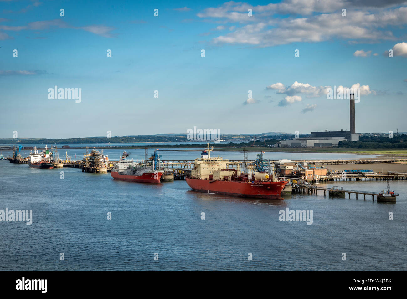 working ships alongside a dock Stock Photo