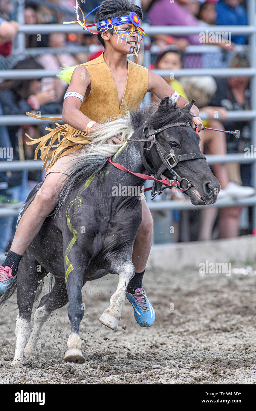 Little Braves competitor at the Kainai Indian Relay (horse) Race in