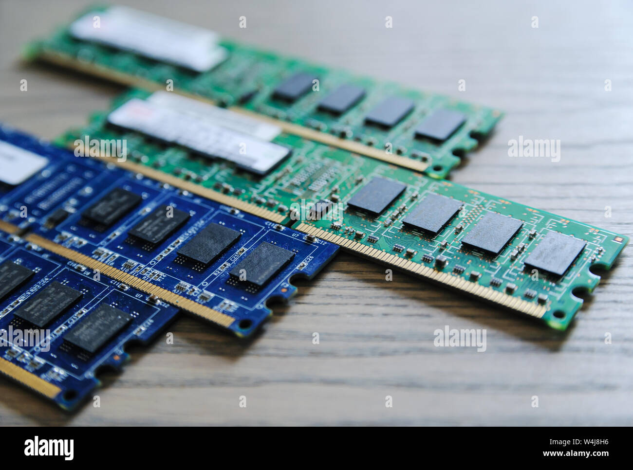 Different memory slots are on the wooden table. Stock Photo