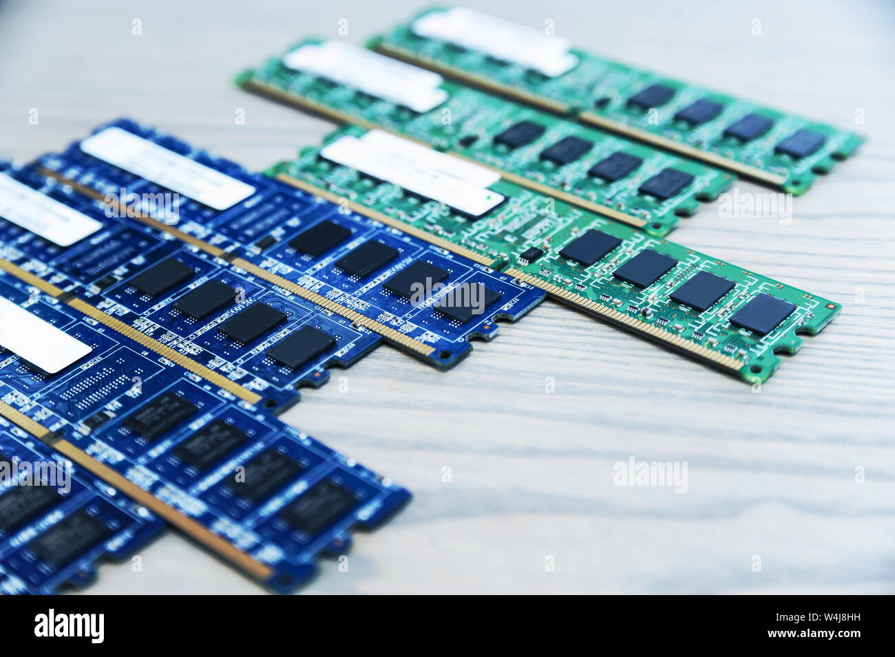 Different memory slots are on the wooden table. Stock Photo