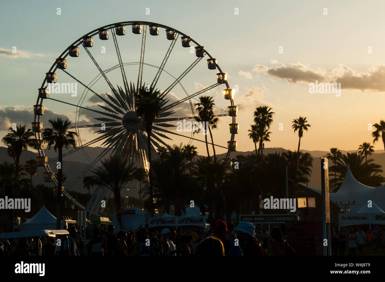 Iconic ferris wheel and participants at the Coachella Valley Music