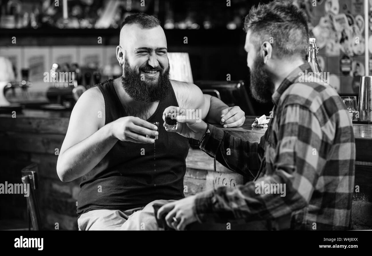 Cheers concept. Hipster brutal bearded man drinking alcohol with friend ...