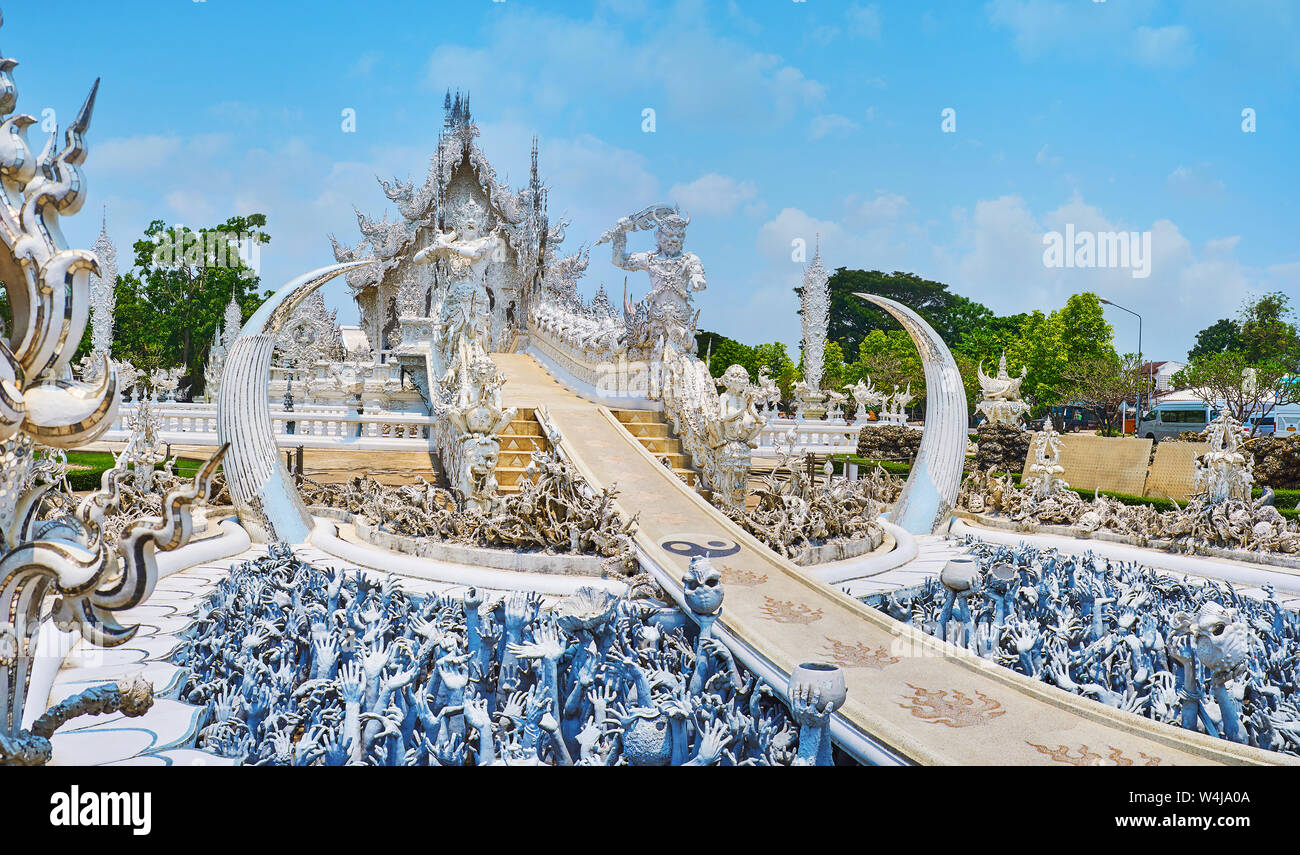 Hundreds of dark hands, rising from under the ground symbolize low materialistic desires, people must to pass through to reach harmony and purity of W Stock Photo