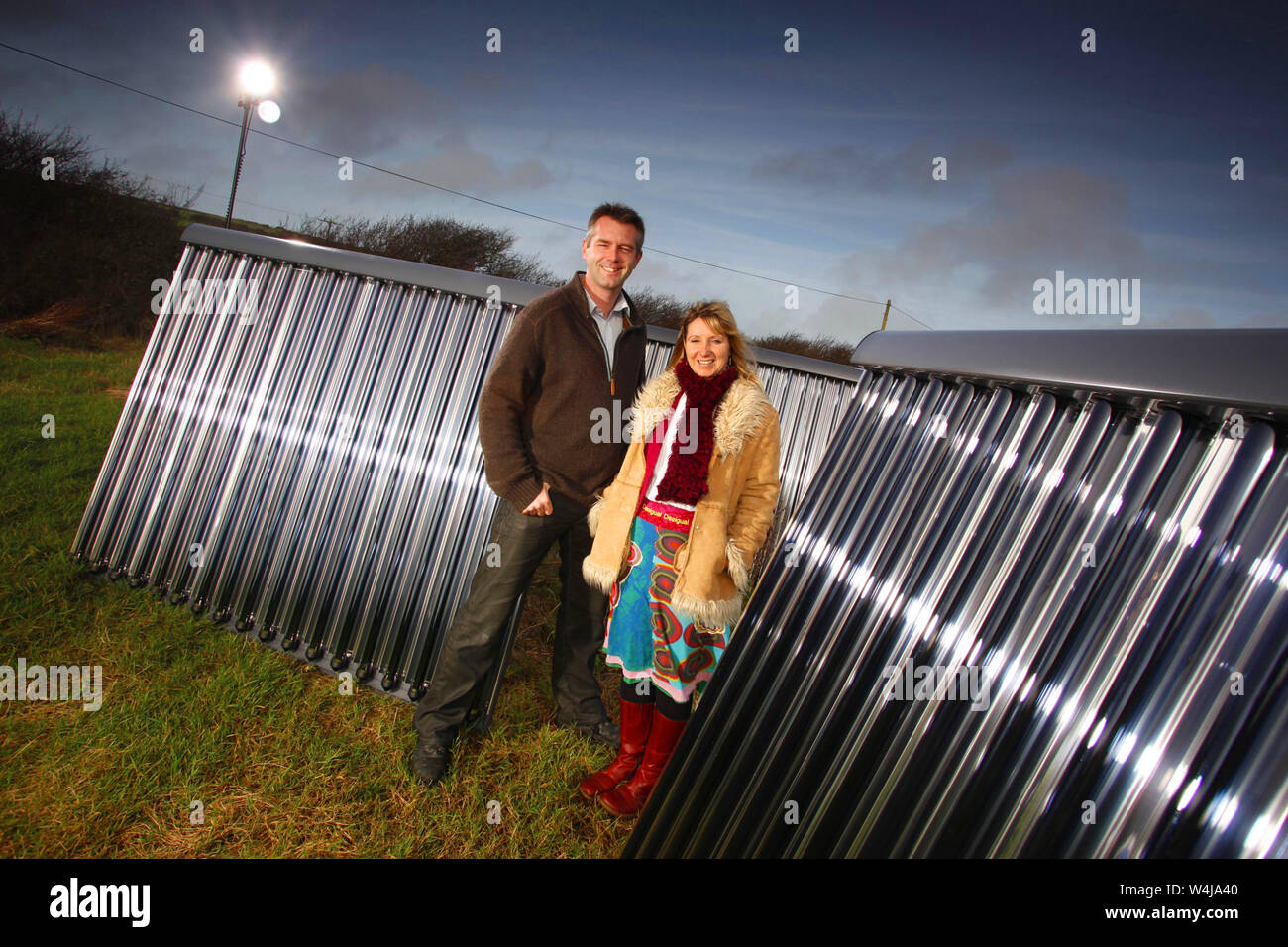 09.12.2009 - Dr Matthew and Dr Kay Trewhella of Independent Energy in Penzance, Cornwall, with Ritter solar thermal panels. Stock Photo